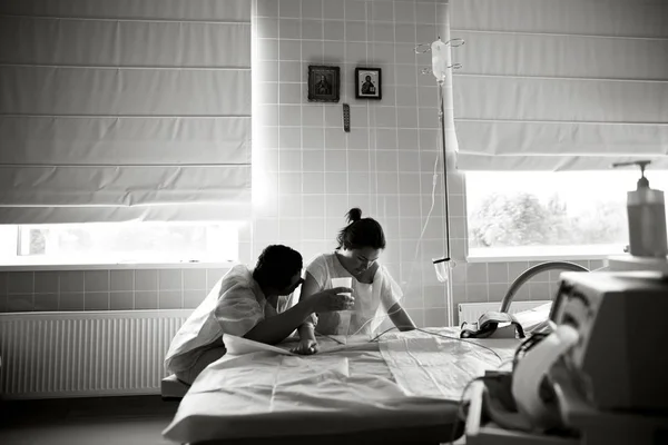 Young Woman Giving Birth Her Husband Ward Stock Image