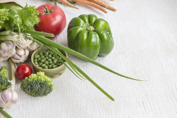 Healthy food in paper bag of different  vegetables on white background. Top view