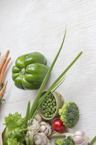 Healthy food in paper bag of different  vegetables on white background. Top view