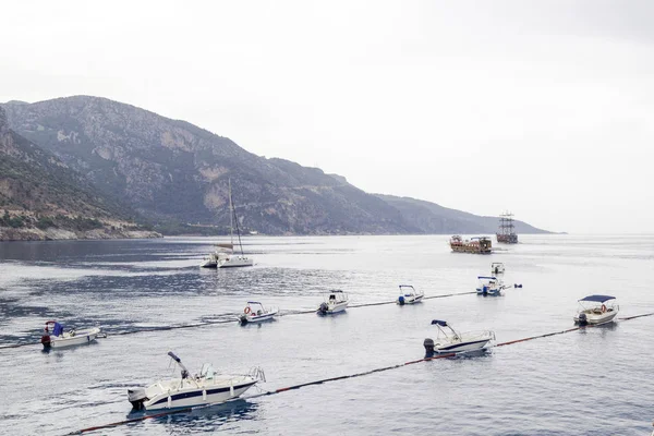 Motor boats go to sea in two rows