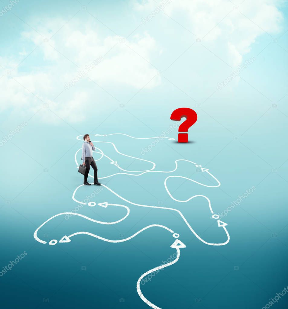 Businessman following a drawn path to a question mark. The concept of unknown