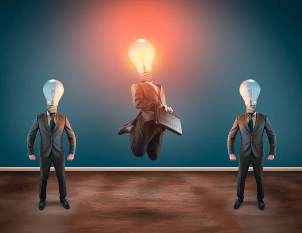 Group of business man with lightbulbs instead of head. Lit lightbulb businessman jumping.