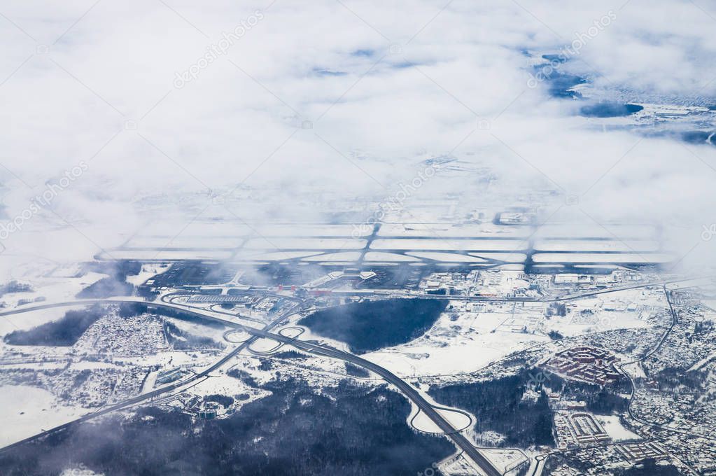 View of the sheremetyevo airport in winter from plane window.