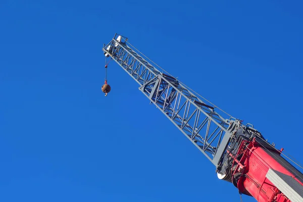 Construction crane red hoist lifting machine insdustrial hook — Stock Photo, Image