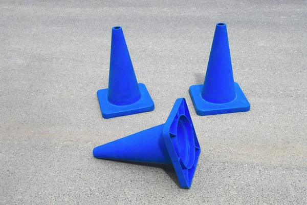 blue traffic cones under construction web site sign