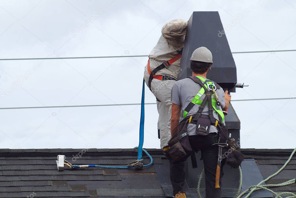 roof repair construction worker roofer man roofing security rope 