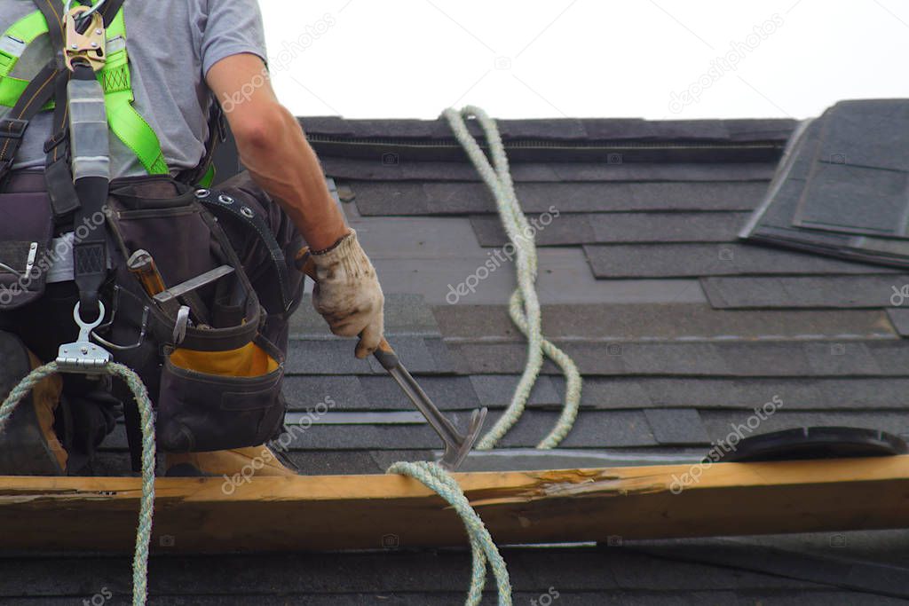 roof repair construction worker roofer man roofing security rope 