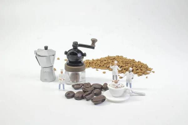 mini figures working on coffee at macro