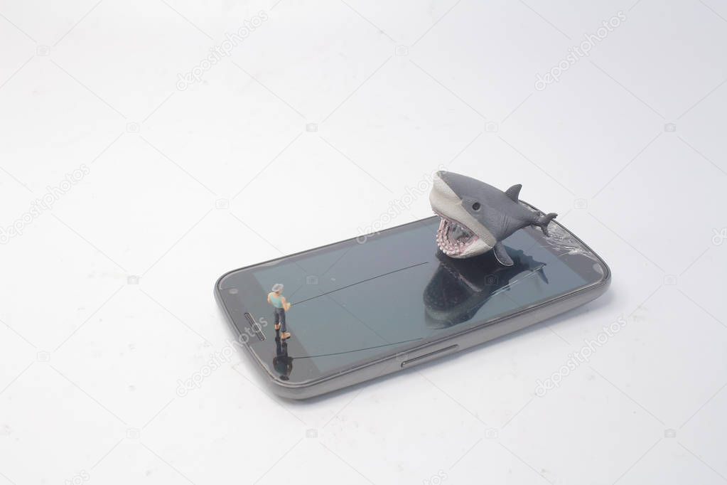 the Cyber thief hacker figure holding fishing