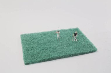 mini figür sünger üzerinde golf oynamak