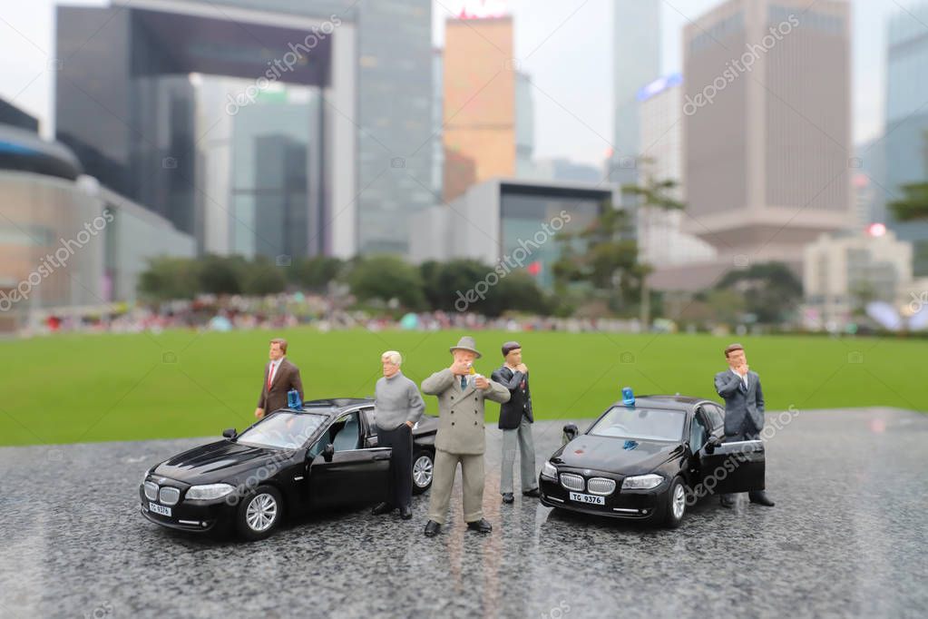 The figure of Detective and police car