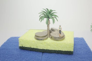 İş adamı ve sikke yığını rakam