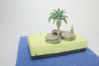 İş adamı ve sikke yığını rakam