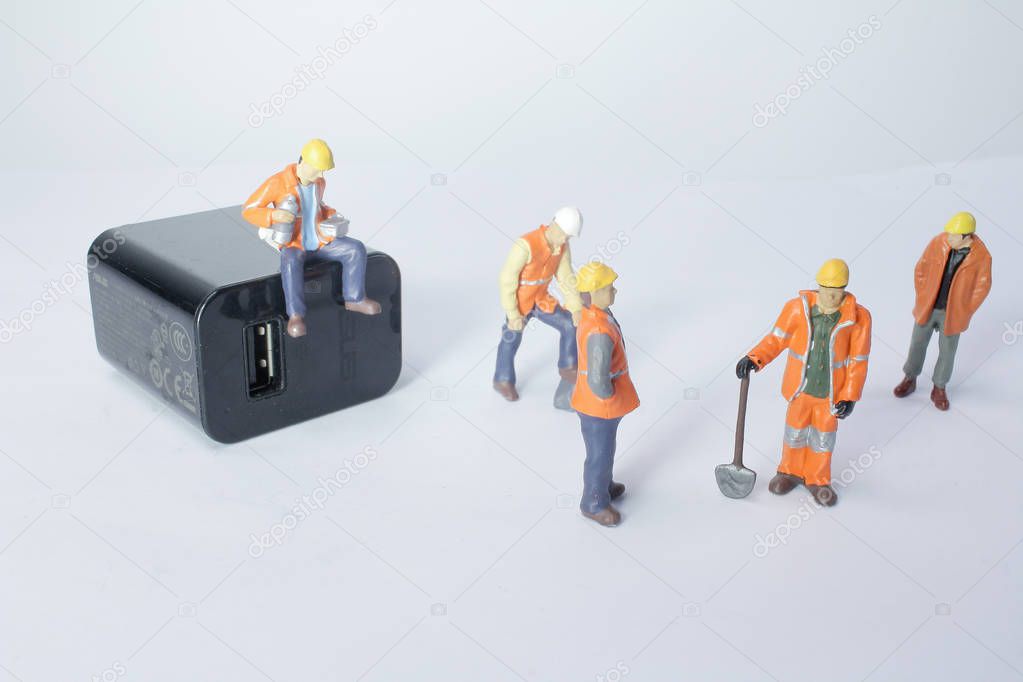 Mini worker figure with charger plug