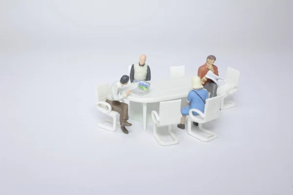 a Business group meeting of the tiny figure