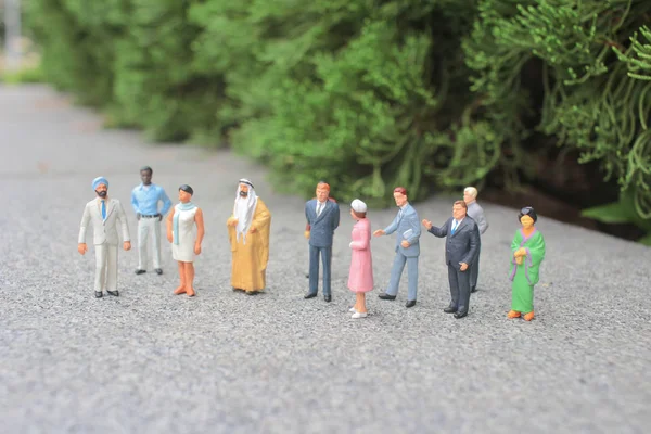 The mini of figure of foreigner on the meeting — Stock Photo, Image