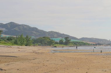 Lau Fau Shan'da gün batımı plajı Hk