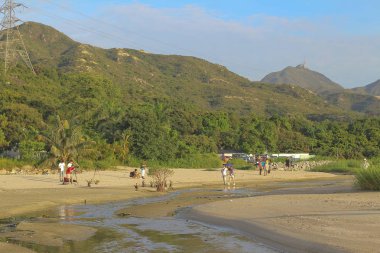 Ha pak nai hong kong'da gün batımı plajı 