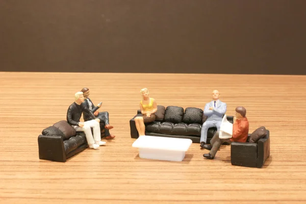 the tiny of figure at meeting in center.