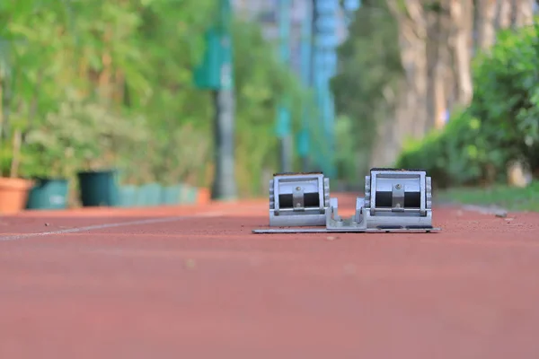 Athletics Starting Blocks and red running tracks in stadion