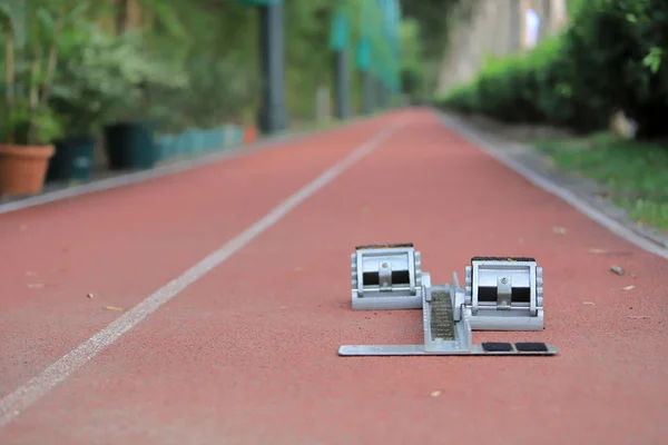 Athletics Starting Blocks and red running tracks in stadion