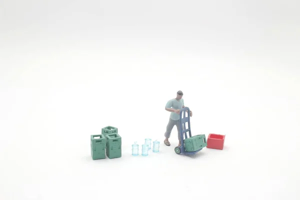 Mini figura, trabajadores, empleados ayudan a mover — Foto de Stock
