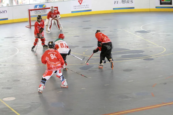 Men play hockey at indoor sport center — Stock Photo, Image