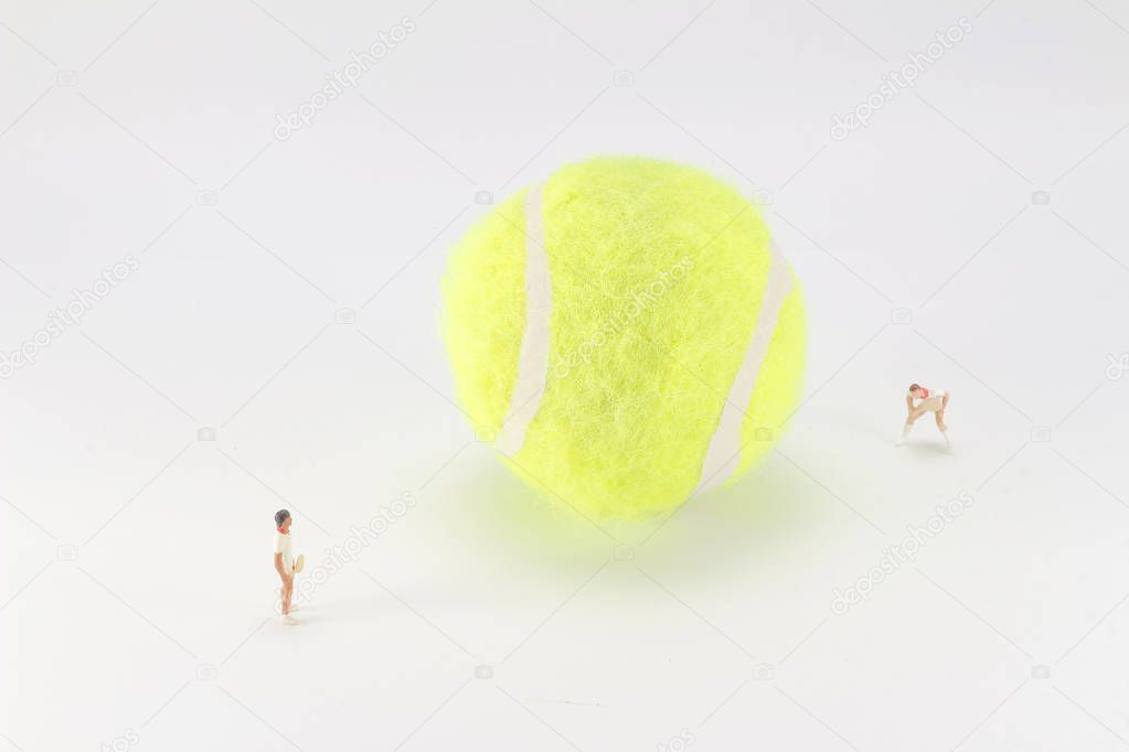 Tiny toys play tennis on the big tennis 