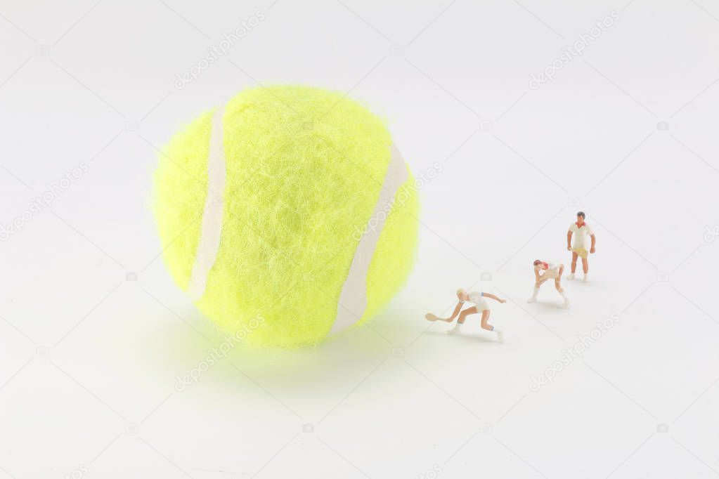 Tiny toys play tennis on the big tennis 