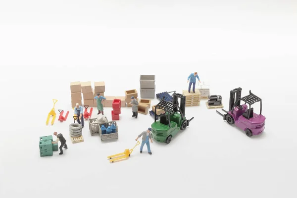 Mini do trabalhador da figura, conceito da construção e da logística — Fotografia de Stock