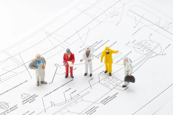 A Sketching Plane with the mini figure worker — Stock Photo, Image