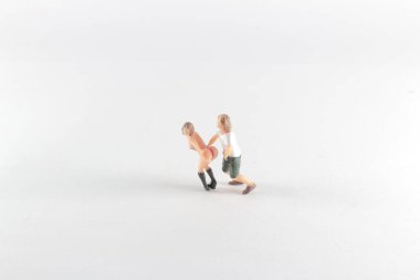 mni figure with sexual pose on white back ground 