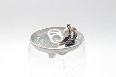 a scale of lover figure set on the can