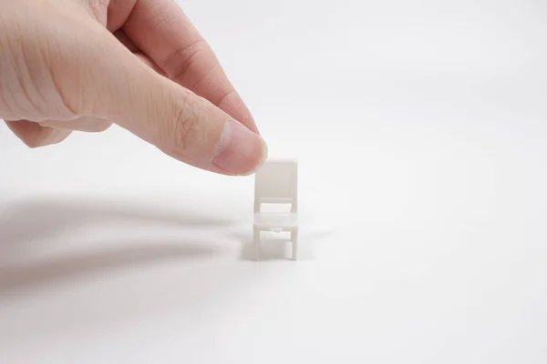 Miniature furniture made of cardboard, painted white. Doll table with chair scale