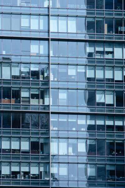1 Sept 2007 blue sky Reflected in Windows of Modern Office Building.