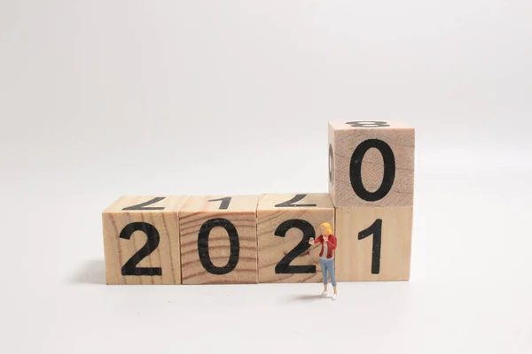 a New year 2020 change to 2021 concept, with small figure