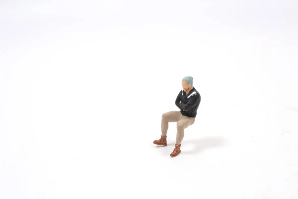 Der Mini Der Figur Sitzen Sitzende Männer — Stockfoto