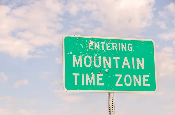 Green White Sign Bullet Holes Letting Travelers Know Entering Mountain — Stock Photo, Image