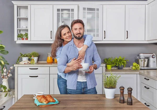 Young couple in love in the kitchen