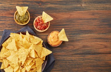 Tortilla chips with sauces clipart