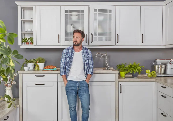 Cheerful man in kitchen