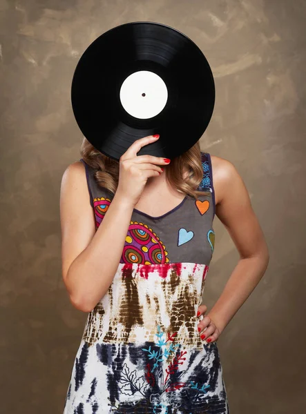 Girl holding a vinyl