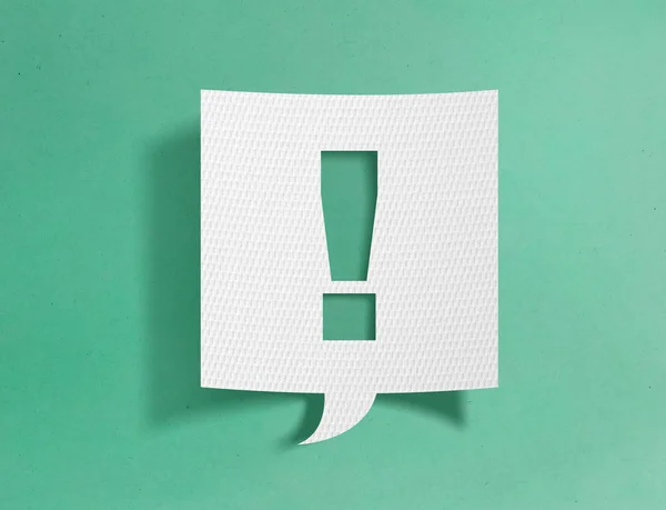 Speech bubble with exclamation point on green background