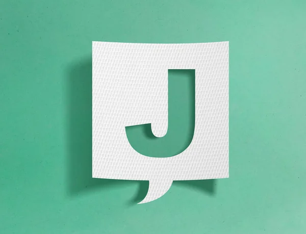 Speech bubble with letter J on green background