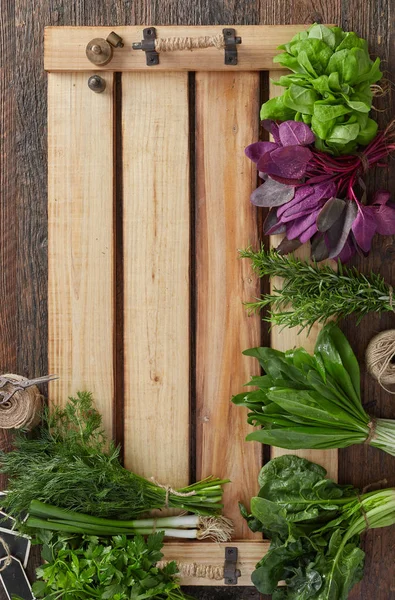 Herb leafs on wood tray — Stock Photo, Image