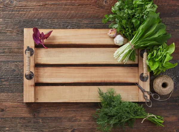 Herb leafs on wood tray — Stock Photo, Image