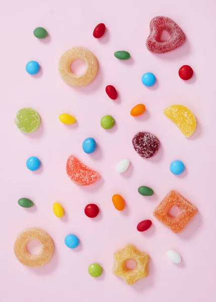 Colorful candy on pink — Stock Photo, Image