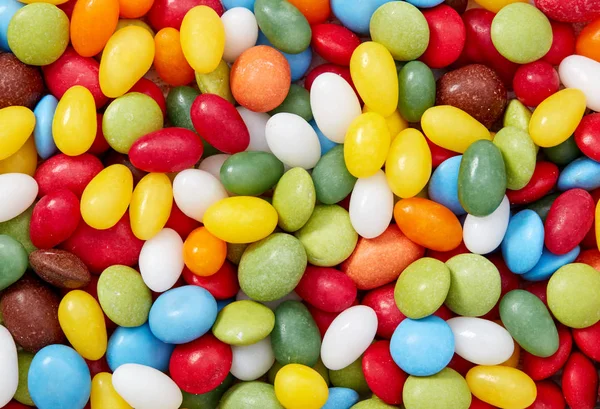 Colored candy pills background — Stock Photo, Image