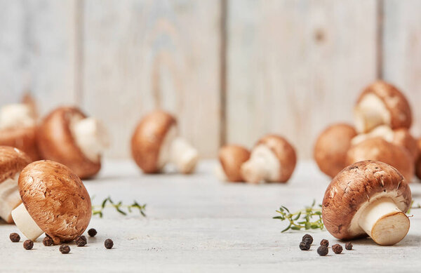 Beautiful farm mushrooms on wooden table