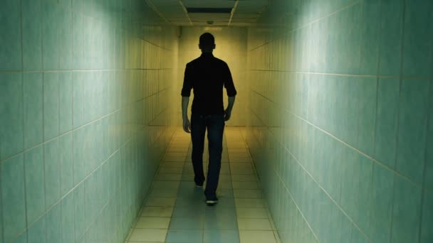 Man walk away down a corridor — Stock Video